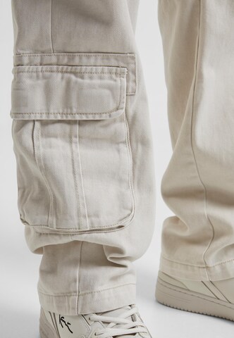 Karl Kani Regular Cargo trousers in Beige