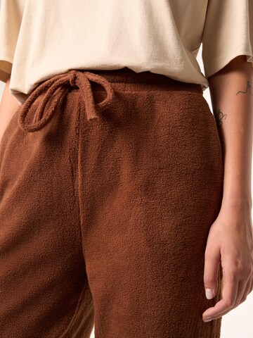 ABOUT YOU x Laura Giurcanu Tapered Pants 'Holly' in Brown