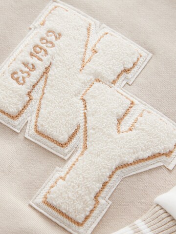 Next Демисезонная куртка 'Bestickte Varsity' в Бежевый