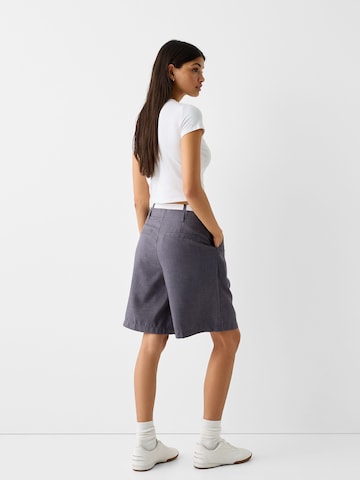 Bershka Loose fit Pleat-front trousers in Grey