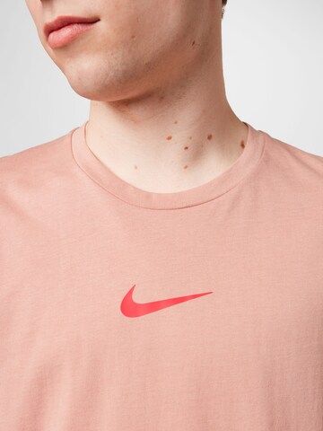 NIKE - Camiseta funcional 'Burnout' en rosa