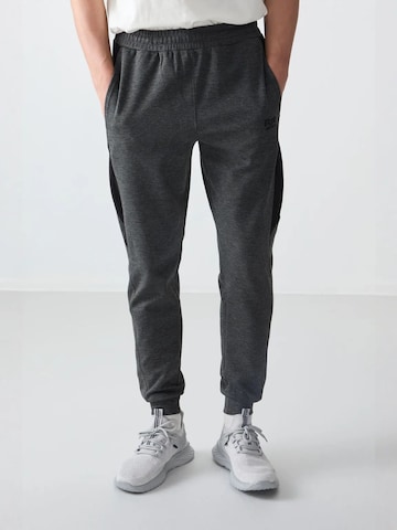 Tommy Life Regular Trousers in Grey: front