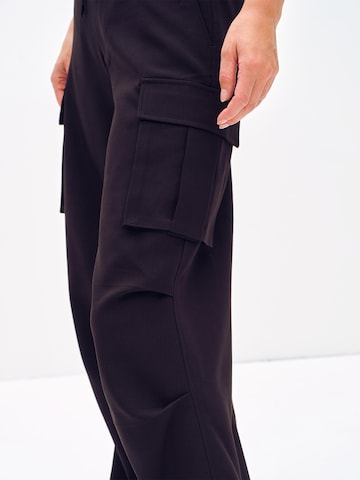 ABOUT YOU x Toni Garrn Loose fit Cargo trousers 'Dakota' in Black