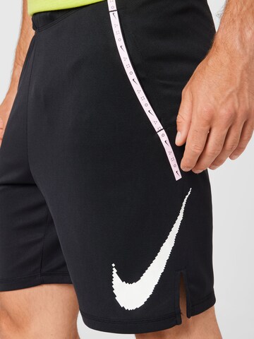 NIKE Regular Sports trousers in Black