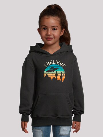 Sweat-shirt 'I Believe UFO Alien Sonnenuntergang' F4NT4STIC en noir : devant