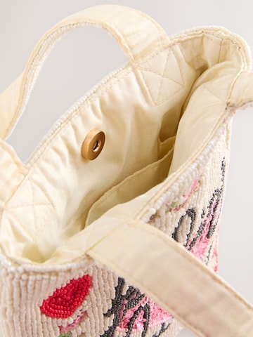 Next Ostoskassi värissä valkoinen