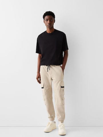 Bershka Tapered Hose in Beige