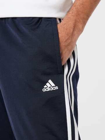 ADIDAS SPORTSWEAR Tapered Workout Pants 'Essentials Warm-Up Tapered 3-Stripes' in Blue