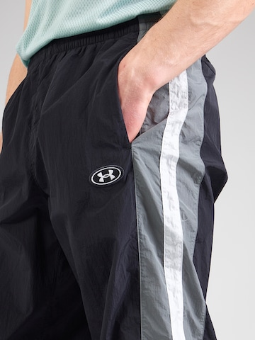 UNDER ARMOUR - Tapered Pantalón deportivo en negro