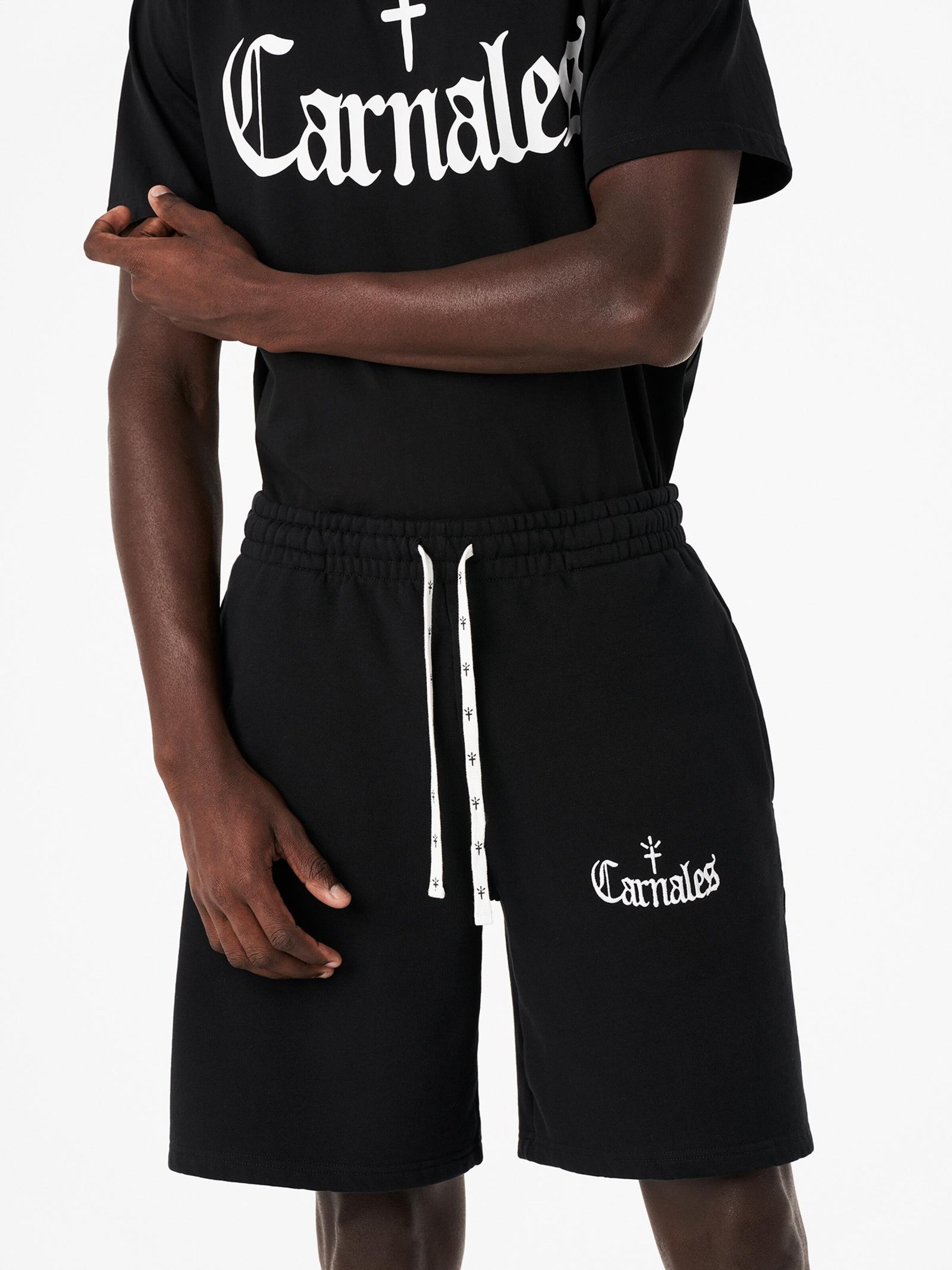 Carnales - Loosefit Pantalón en negro: frente