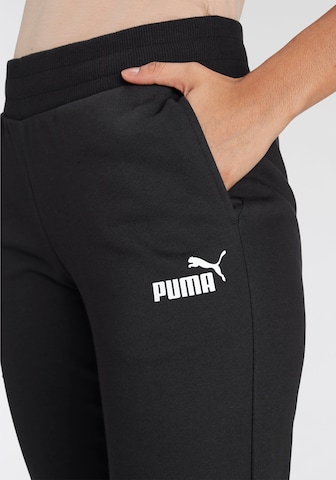 PUMA Tapered Sports trousers in Black