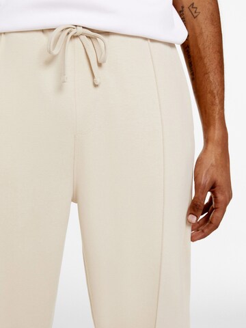 Bershka Loose fit Trousers with creases in Beige