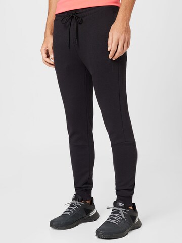 Champion Authentic Athletic Apparel - Skinny Pantalón en negro: frente