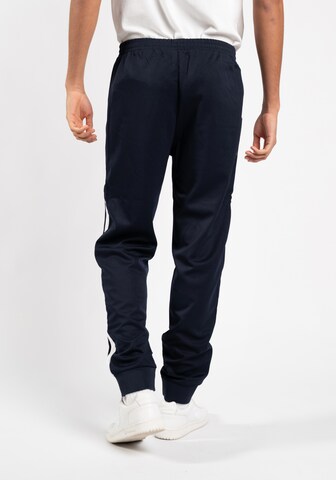 Sergio Tacchini Alt kitsenev Spordipüksid 'NEW DAMARINDO', värv sinine