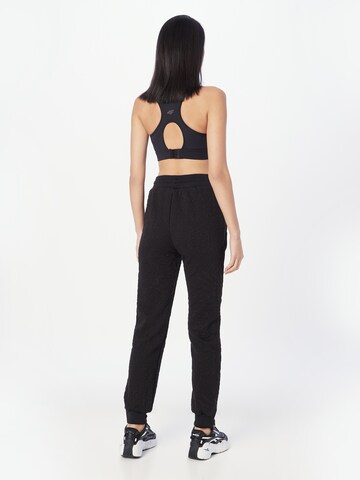 GUESS Tapered Sporthose 'CARINE' in Schwarz