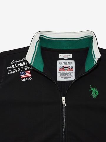 Veste de survêtement U.S. POLO ASSN. en noir