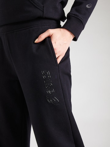 Effilé Pantalon de sport ASICS en noir