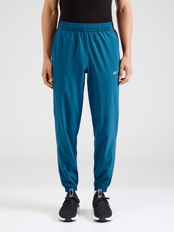 Effilé Pantalon de sport Reebok en bleu : devant