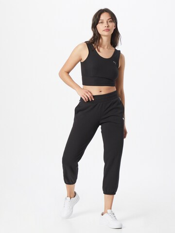 Effilé Pantalon de sport PUMA en noir