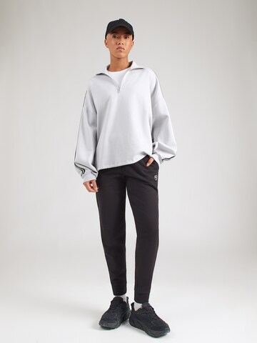 PUMA Конический (Tapered) Спортивные штаны 'Ess' в Черный