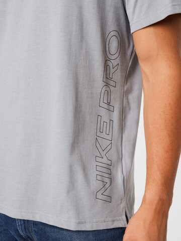 NIKE - Camisa funcionais 'Burnout' em cinzento