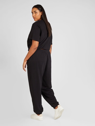 Reebok Tapered Sports trousers in Black