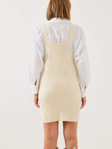 Bianco Lucci Комбинезон с юбкой в Бежевый