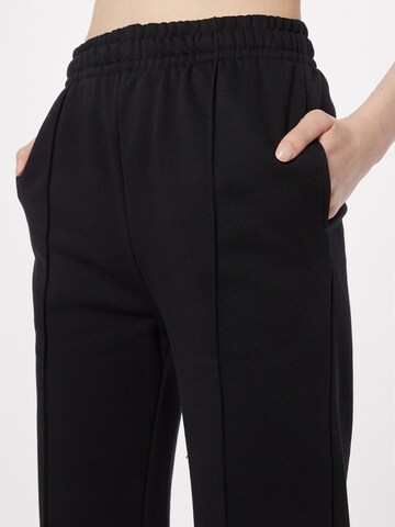 Urban Classics Flared Pants in Black