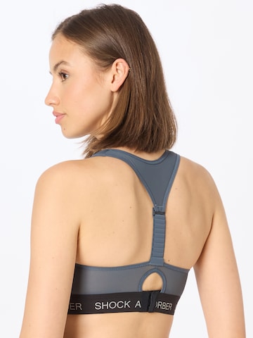 SHOCK ABSORBER Bustier Sportmelltartók 'Infinity Power' - fekete