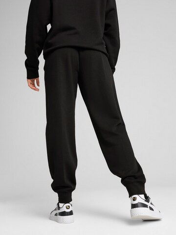PUMA - Tapered Pantalón deportivo 'Ess Nature 2.0' en negro