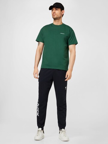 UNDER ARMOUR Tapered Sporthose in Schwarz