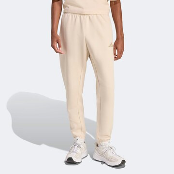 ADIDAS SPORTSWEAR Tapered Workout Pants in Beige: front