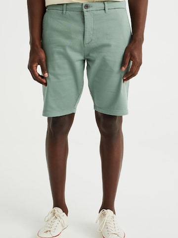 WE Fashion - Slimfit Calças chino em verde