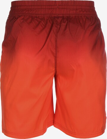 PUMA Regular Workout Pants in Orange