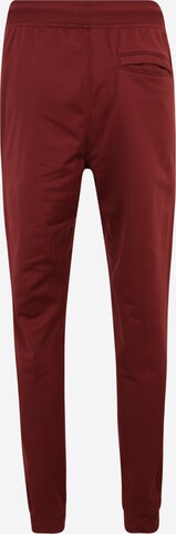 UNDER ARMOUR Tapered Workout Pants in Red