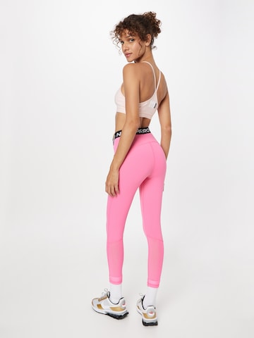NIKE Skinny Spodnie sportowe w kolorze różowy