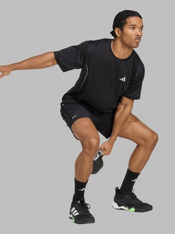 ADIDAS PERFORMANCE Loosefit Urheiluhousut 'Tech Apparel' värissä musta