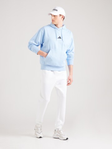 ADIDAS SPORTSWEAR Sports sweatshirt 'FEELCOZY' in Blue