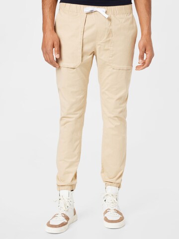 Tommy Jeans Tapered Hose 'Scanton' in Beige: predná strana