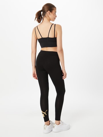 Skinny Pantaloni sportivi di PUMA in nero