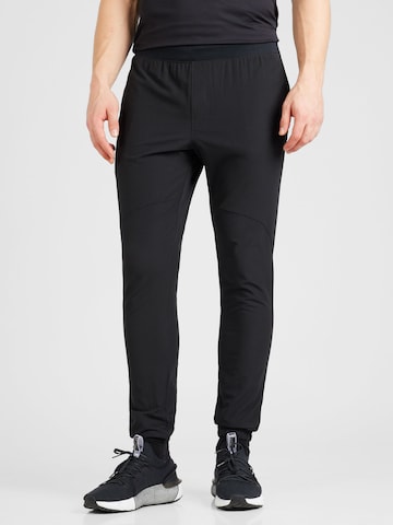 UNDER ARMOUR Tapered Workout Pants in Black: front