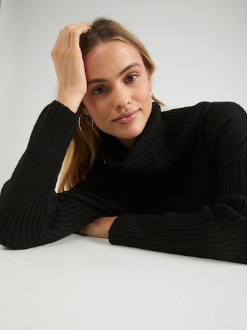 ABOUT YOU Širok pulover | črna barva