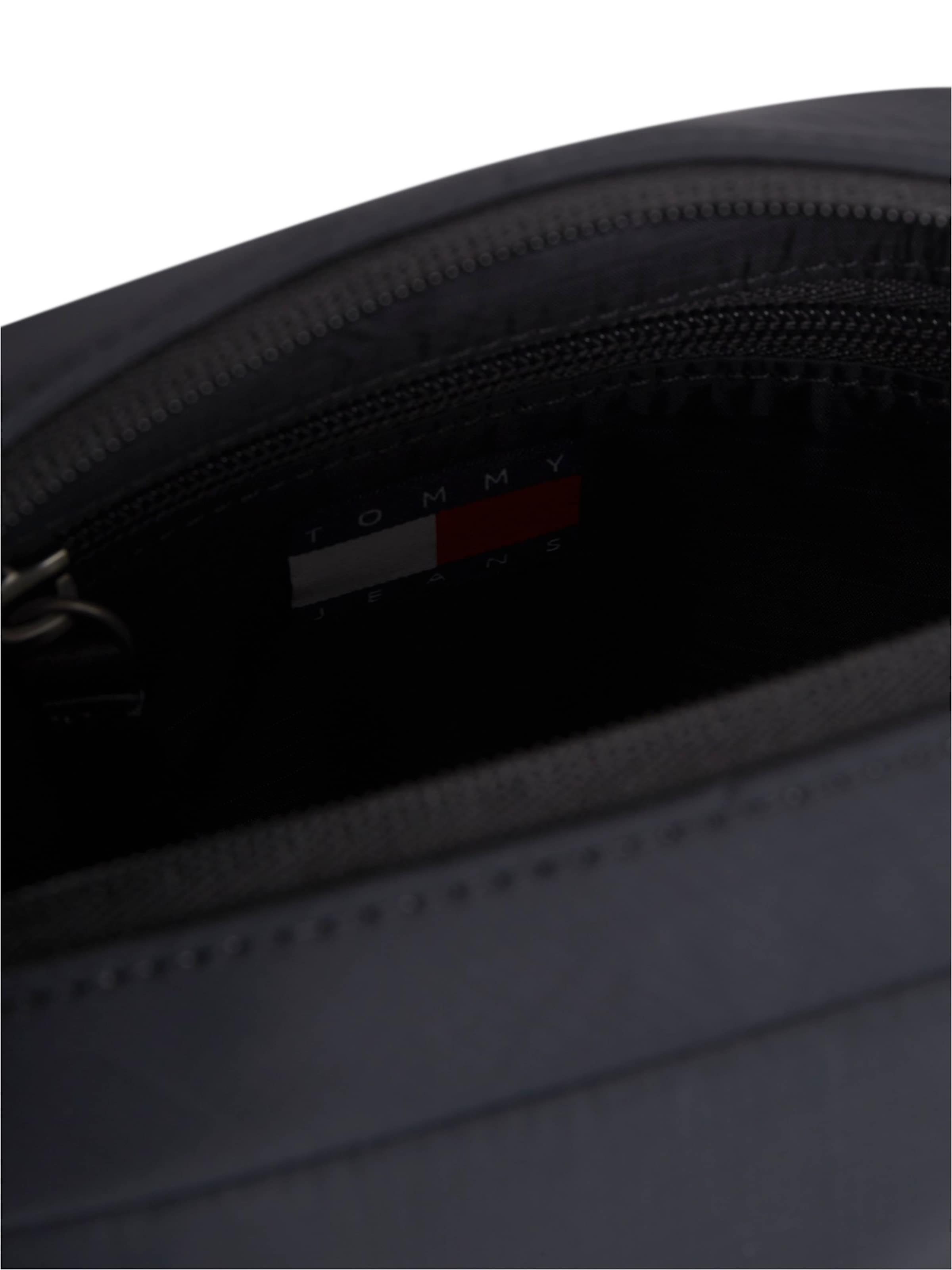 Tommy Jeans Axelremsväska 'REPORTER' i svart