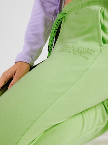 Soccx Zwężany krój Spodnie w kolorze zielony