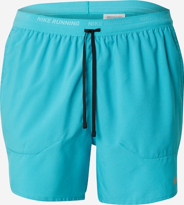 NIKE Sportsbukser 'STRIDE' i grøn: forside