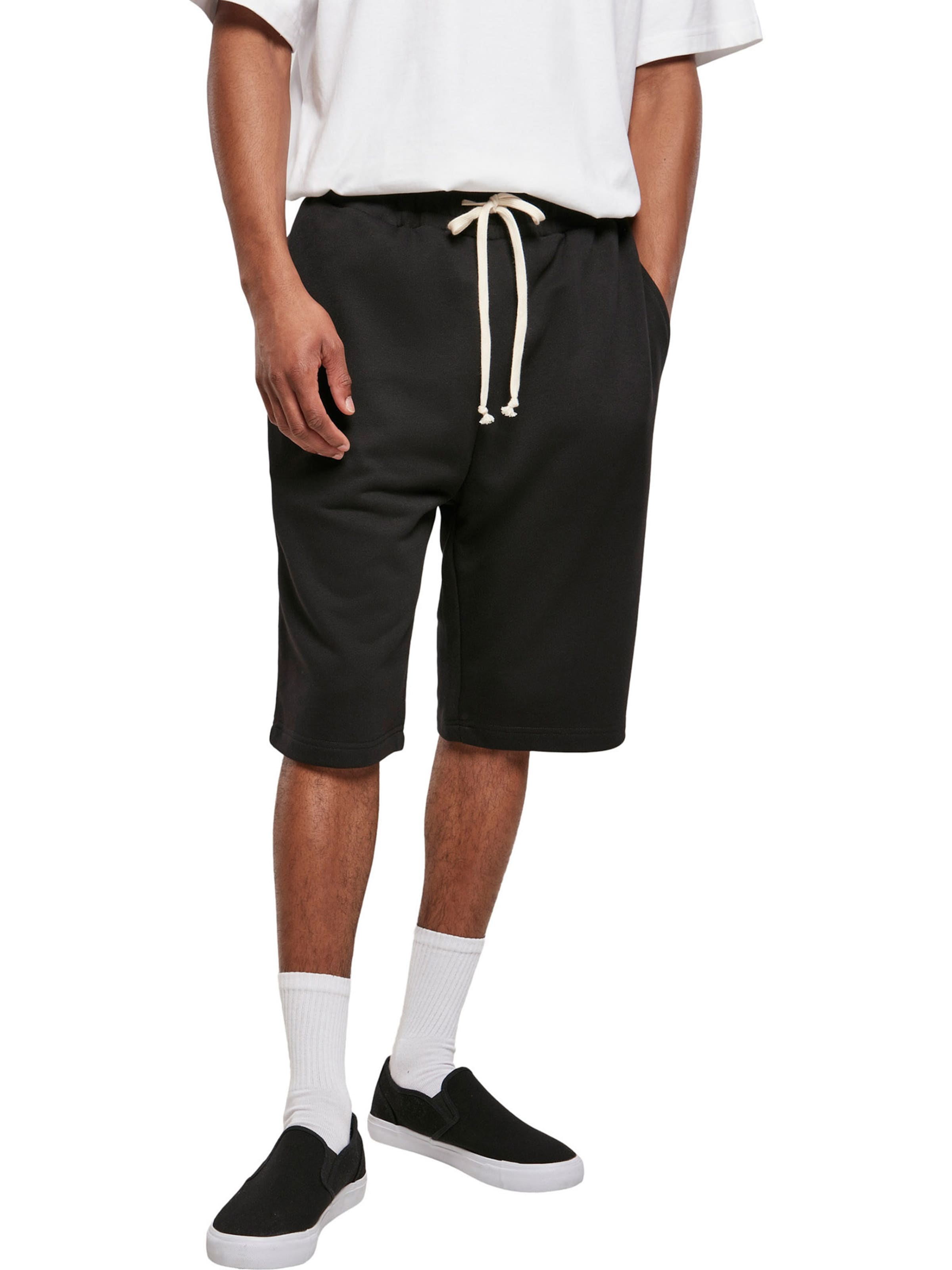 Urban Classics Regular Trousers in Black: front