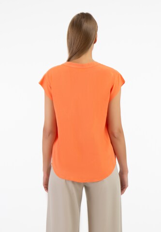 RISA - Blusa en naranja