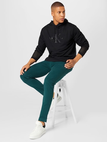 Slimfit Pantaloni eleganți 'XX Chino Slim Tapered' de la LEVI'S ® pe verde