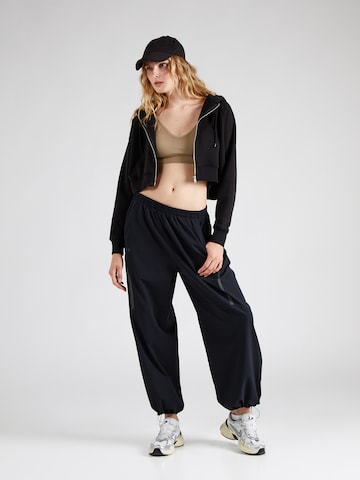 UNDER ARMOUR Tapered Παντελόνι φόρμας 'Unstoppable' σε μαύρο