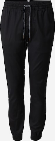 Volcom Zwężany krój Spodnie 'FRICKIN' w kolorze czarny: przód